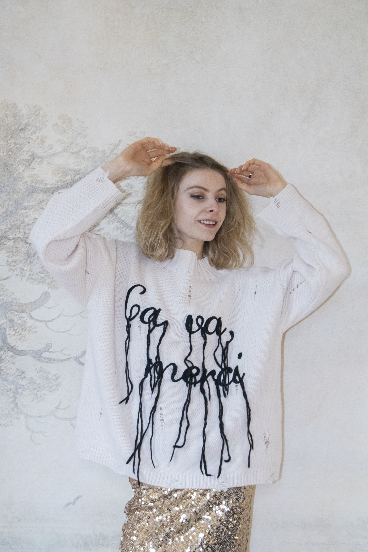 pull avec inscription "ca va merci"